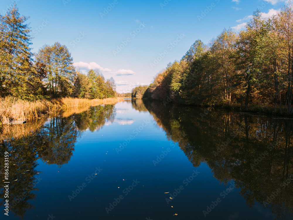 Fototapeta premium Golden red sunlight AERIAL view, Russia, River, small town, bridge