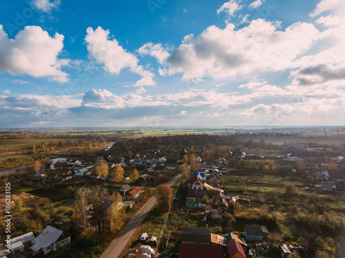 Golden red sunlight AERIAL view, Russia, River, small town, bridge photo