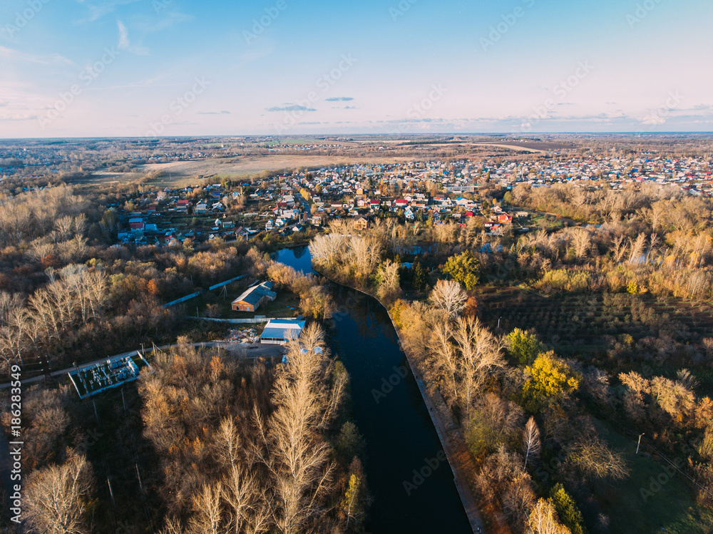 Golden red sunlight AERIAL view, Russia, River, small town, bridge