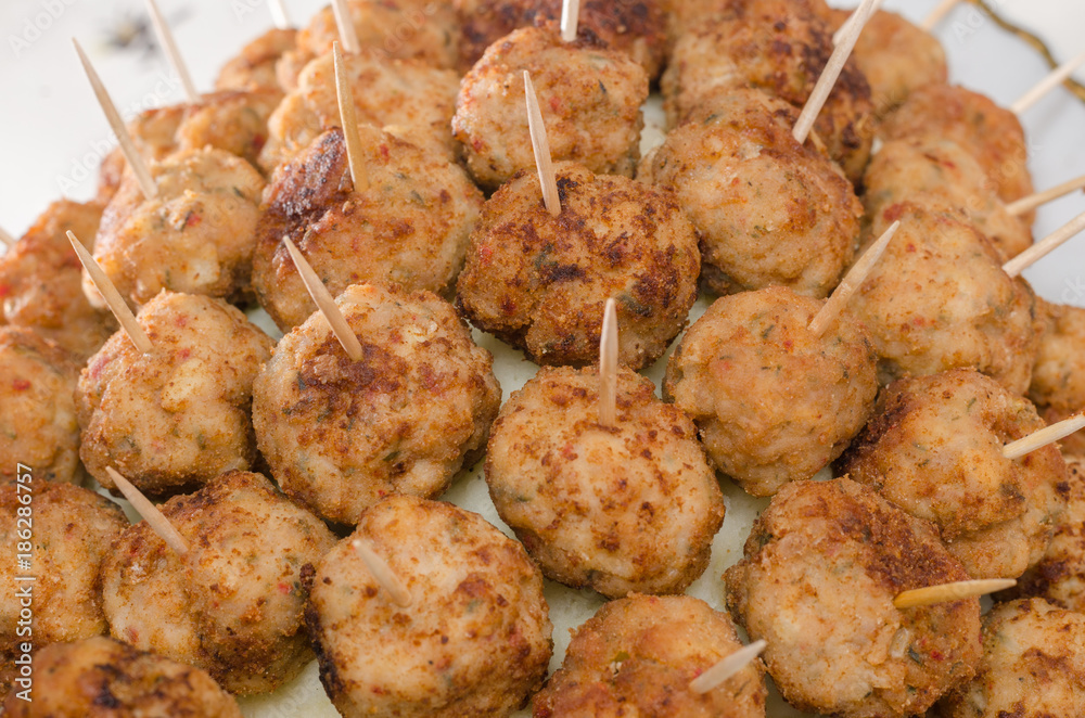 Meatball appetizers with toothpicks on the side Meatball appetizers with toothpicks on the side
