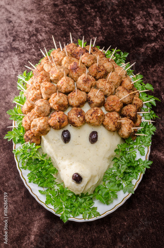 Meat balls hedhehog with potatoes and olives