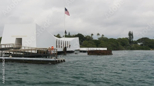 a close up tracking shot of the uss arizona memorial at pearl harbor