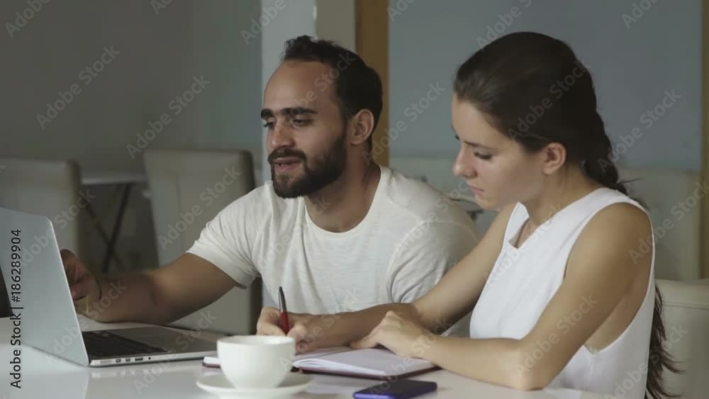 Young multiethnic workers in a creative start up work Young multiethnic workers in a creative start up work
