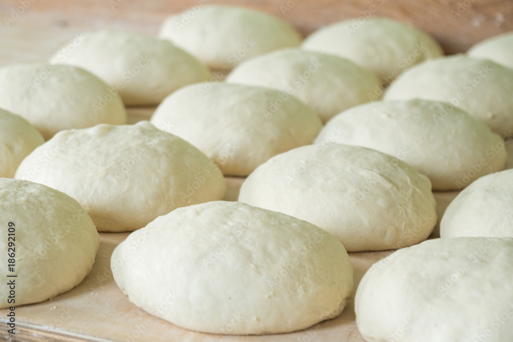 Fresh dough on the wooden board, pizza, Georgian bread