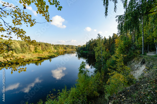 high water level in river Gauja, near Valmiera city in Latvia. summer trees surrounding