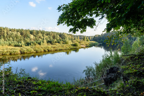 high water level in river Gauja  near Valmiera city in Latvia. summer trees surrounding