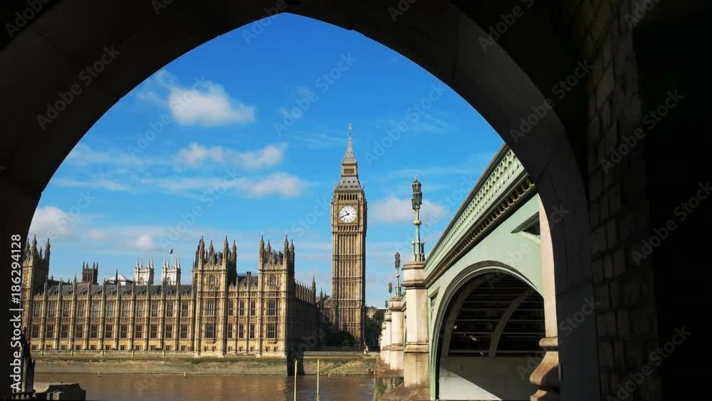 big ben framed by the arch of a bridge in london, england