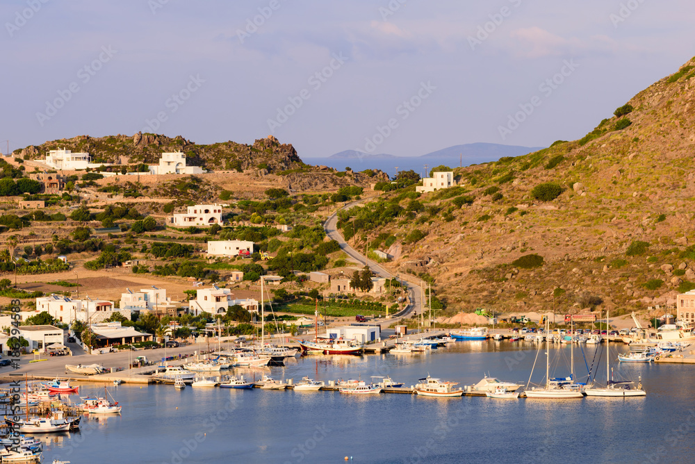 Beautiful view of the harbour village of Skala with its traditional fishing boats and yachts, Patmos island, Dodecanese, Greece Beautiful view of the harbour village of Skala with its traditional fishing boats and yachts, Patmos island, Dodecanese, Greece