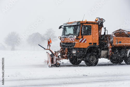 Close up of snow plow in Germany, clearing the roads. Dangerous wether for traffic