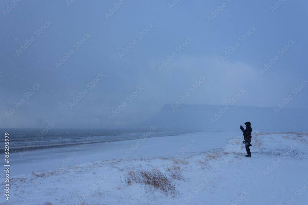 Beach in snow blizzard winter in Iceland