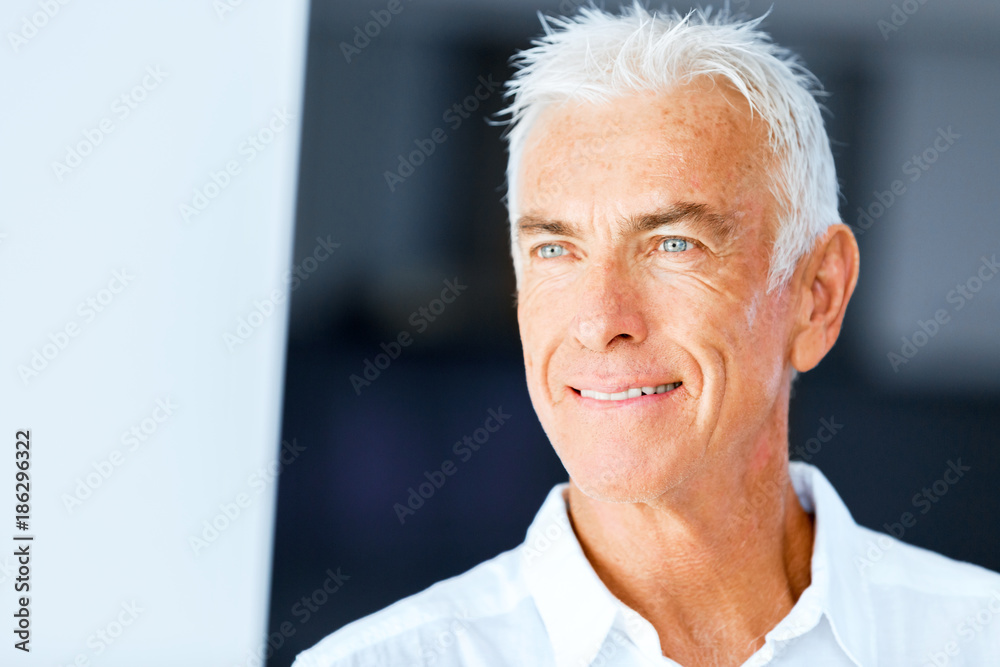 Portrait of a handsome senior man indoor Portrait of a handsome senior man indoor