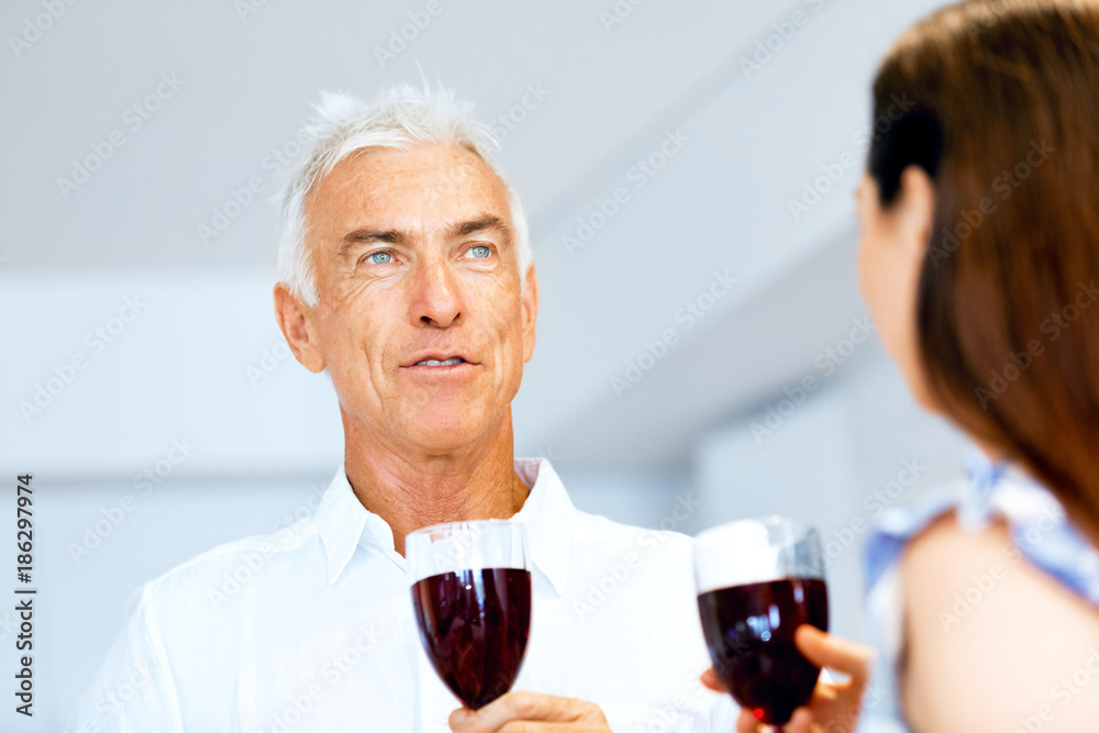 Portrait of a couple having a glass of red wine Portrait of a couple having a glass of red wine