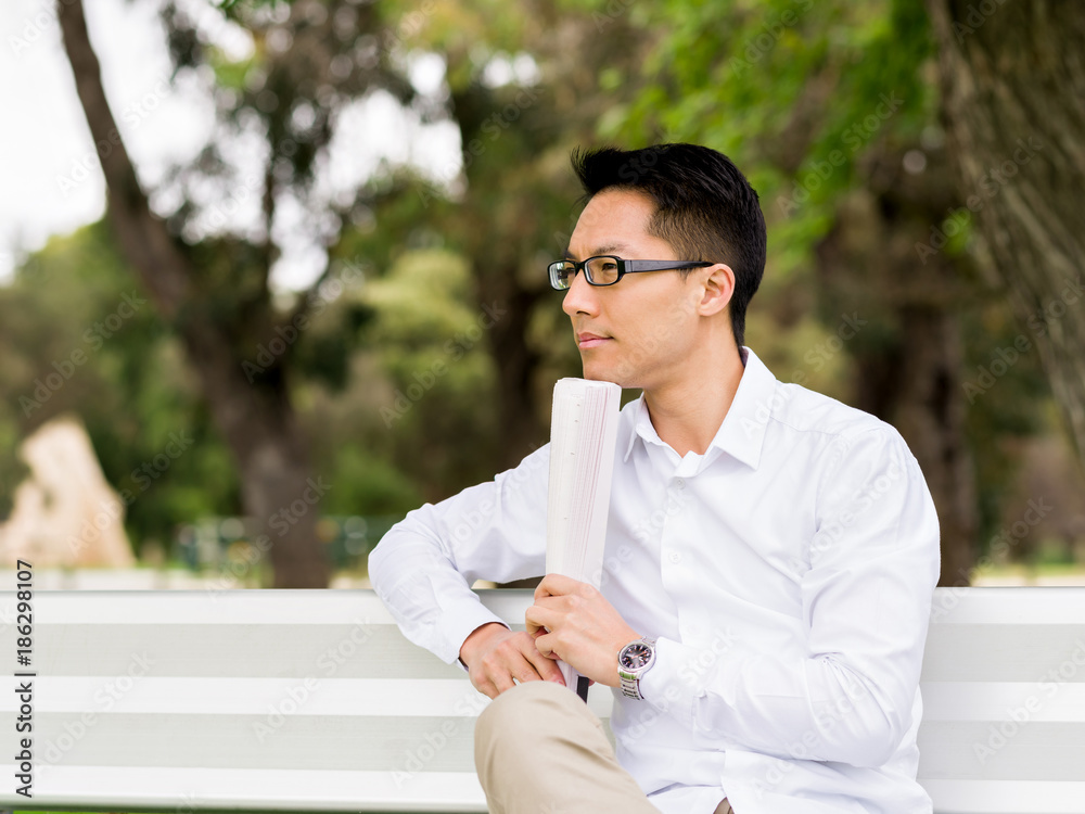 Thinking businessman during his break in park Thinking businessman during his break in park