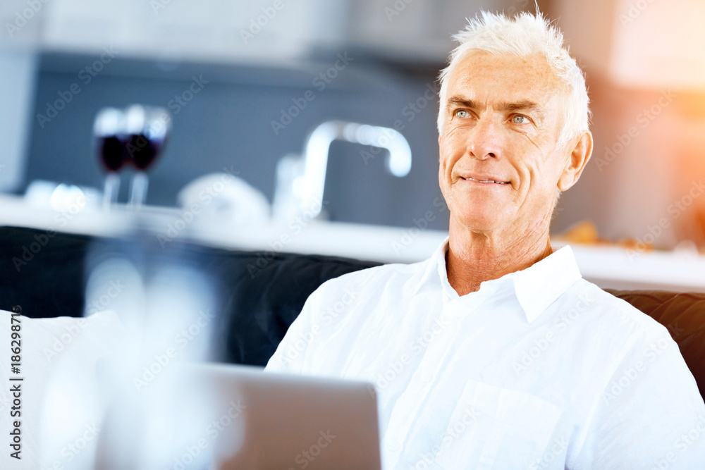 Man working on laptop at home