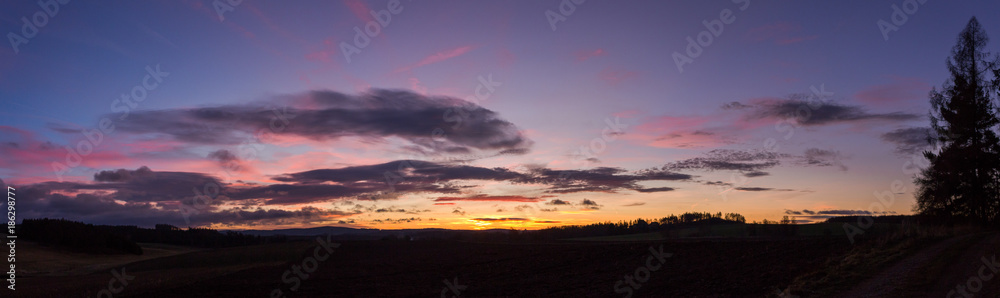 Landscape with colorful sunrise clouds panorama