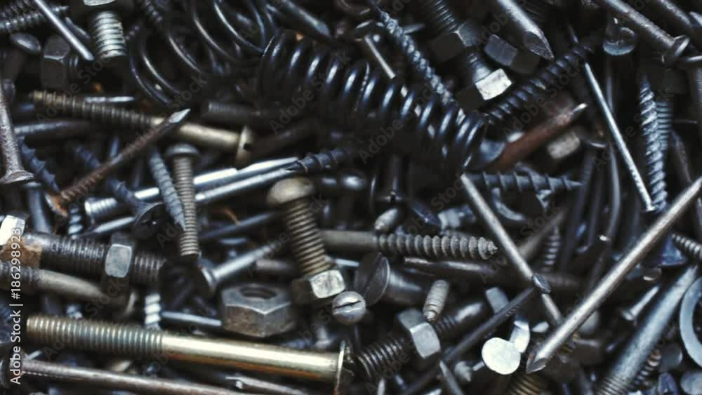 Background of bunch of old nuts bolts and nails