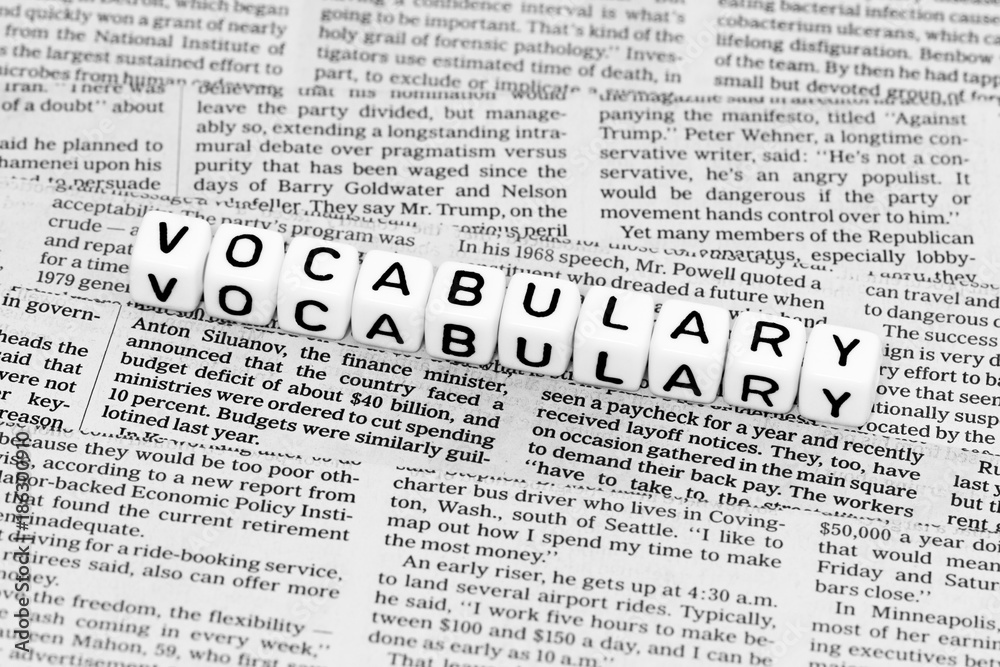 Vocabulary alphabet cubes on newspaper Vocabulary alphabet cubes on newspaper