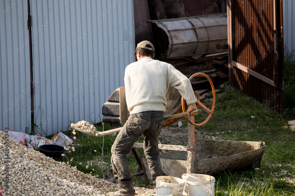 The worker works at the construction site The worker works at the construction site