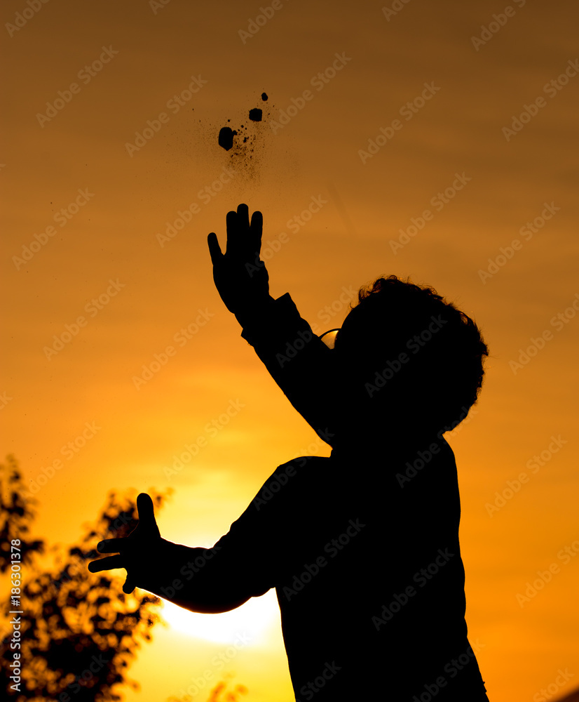 Silhouette of a Boy in the Sunset