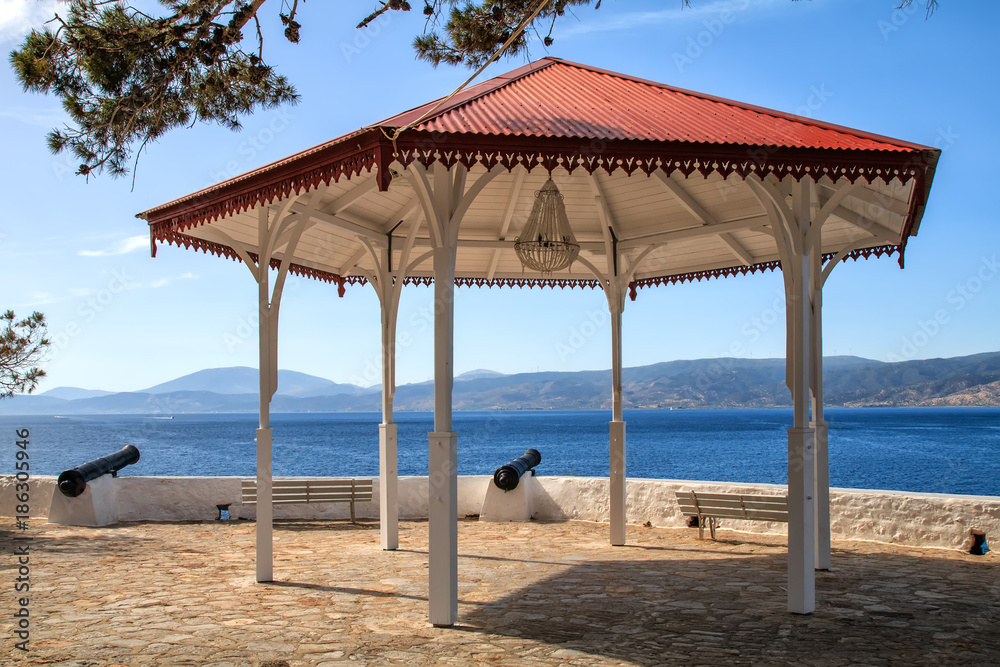 Wooden gazebo near canons at Hydra Island Saronikos gulf in Greece Wooden gazebo near canons at Hydra Island Saronikos gulf in Greece