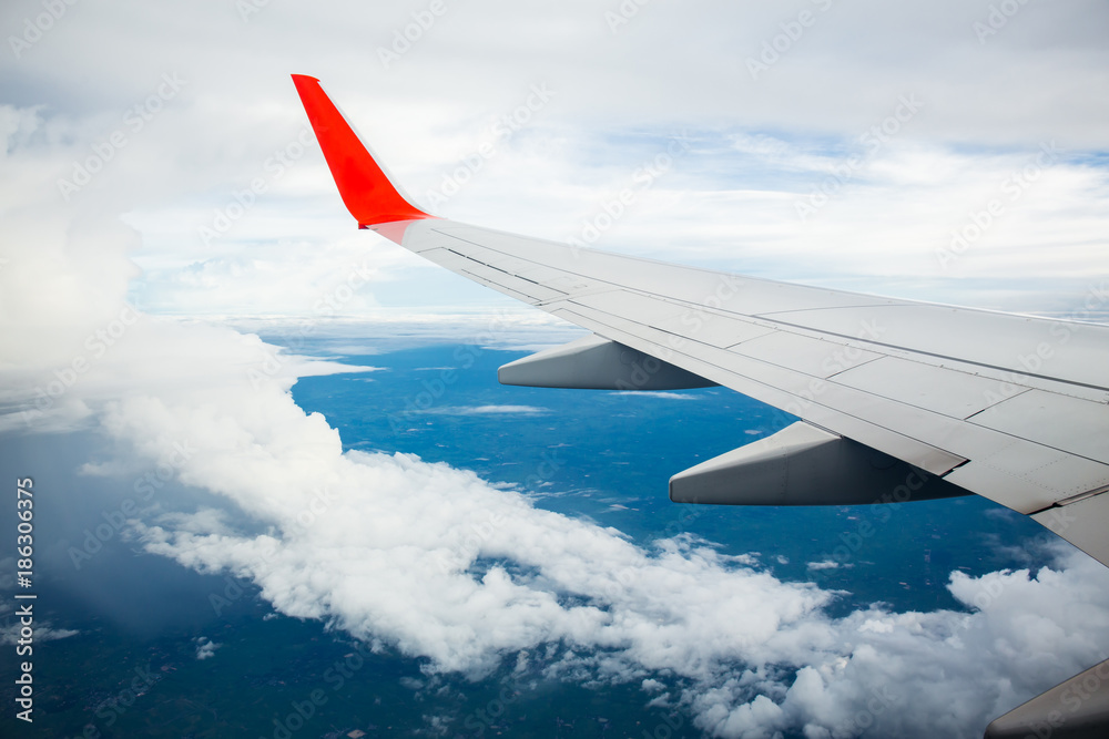 Morning sunrise with Wing of an airplane. Photo applied to tourism operators. picture for add text message or frame website. Traveling concept Morning sunrise with Wing of an airplane. Photo applied to tourism operators. picture for add text message or frame website. Traveling concept