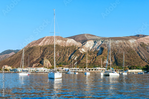 Sailing yachs and catamaran in the Gulf near Vulcano, Aeolian Islands, Tyrrhenian Sea, Sicily, Italy