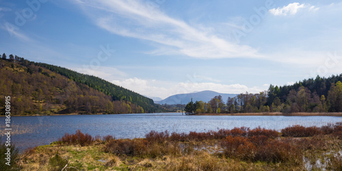 Loch Pityoulish with the mountains of Cairngorms in the background photo