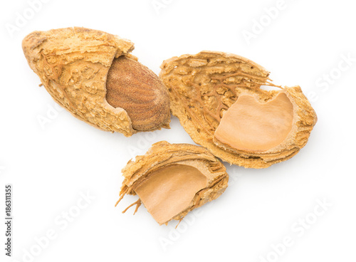 Cracked almond top view isolated on white background.