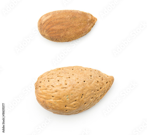 Almonds top view isolated on white background compare shelled and unshelled nuts.