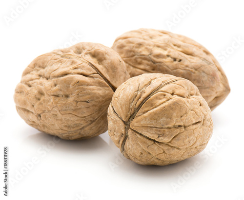 Unshelled walnuts isolated on white background three whole.