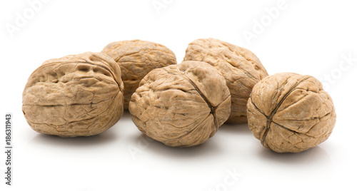 Unshelled walnuts isolated on white background five whole.