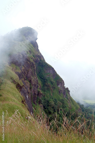 Hiking trail in mountains doimonjong, Landscape with fog at the top of the mountain, Chiang Mai ,Thailand photo