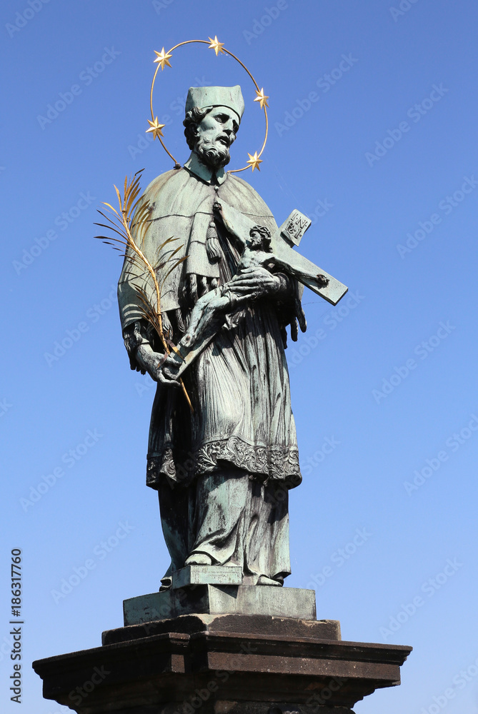 statue of Saint John of Nepomuk who holds the crucifix in his hands