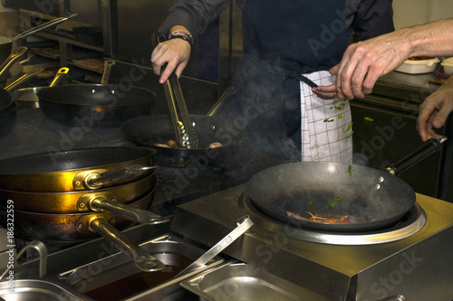 Chef Preparing Meal In A Wok