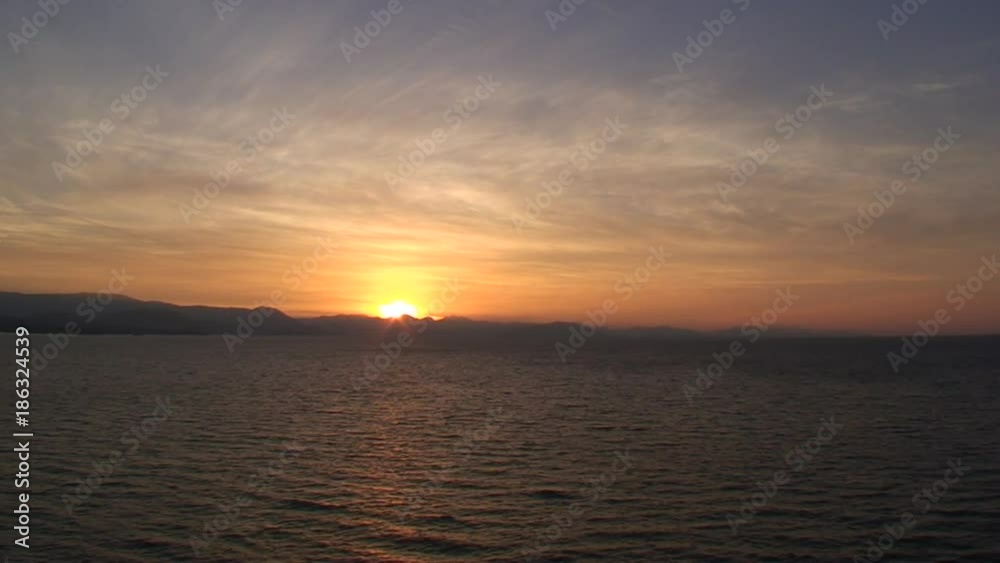 Sunset over ocean waves in Greece Sunset over ocean waves in Greece