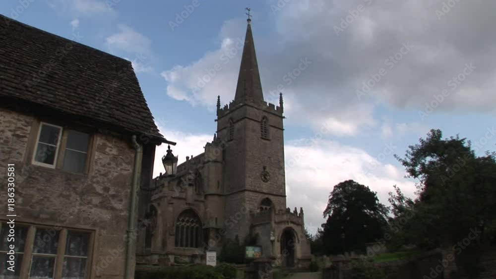 Scenic stone church in Cotswolds, low angle Scenic stone church in Cotswolds, low angle