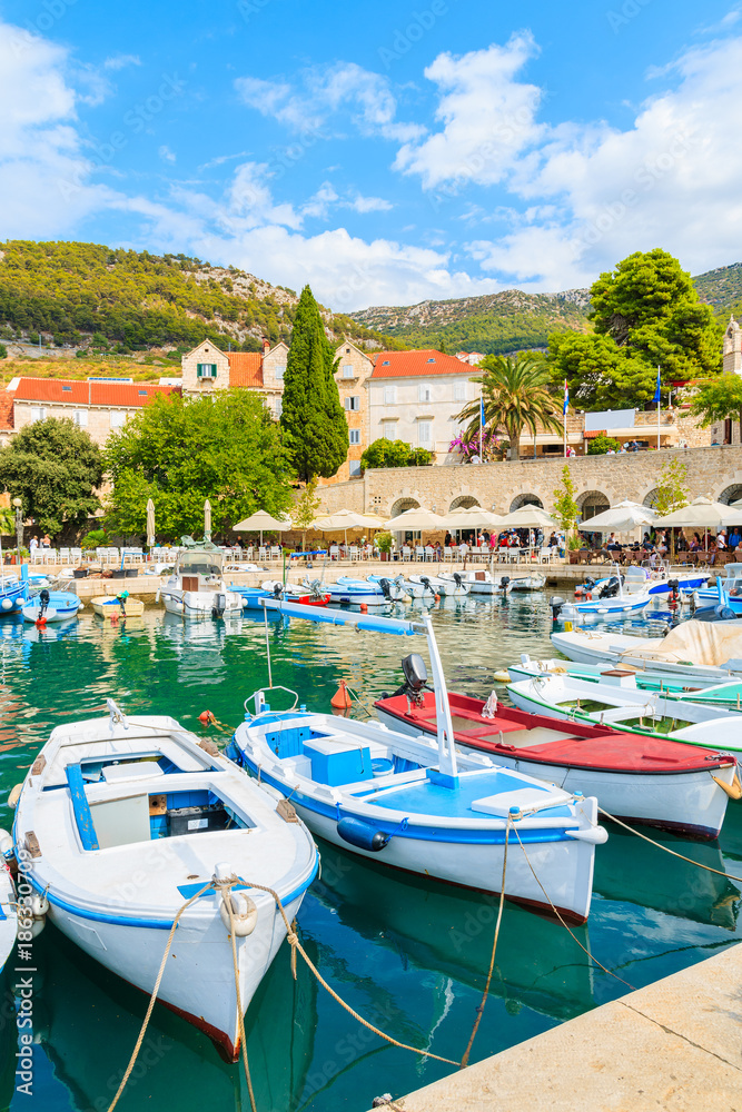 View of Bol port with fishing boats and colorful houses, Brac island, Croatia