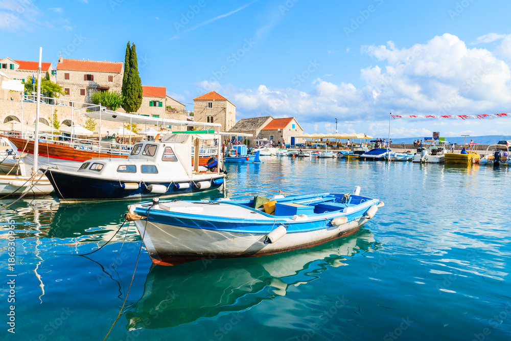 Fishing boats anchoring in Bol port on sunny summer day, Brac island, Croatia
