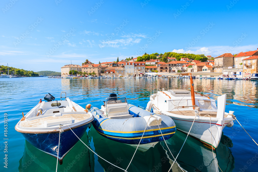 Typical fishing boats mooring in Milna port, Brac island, Croatia