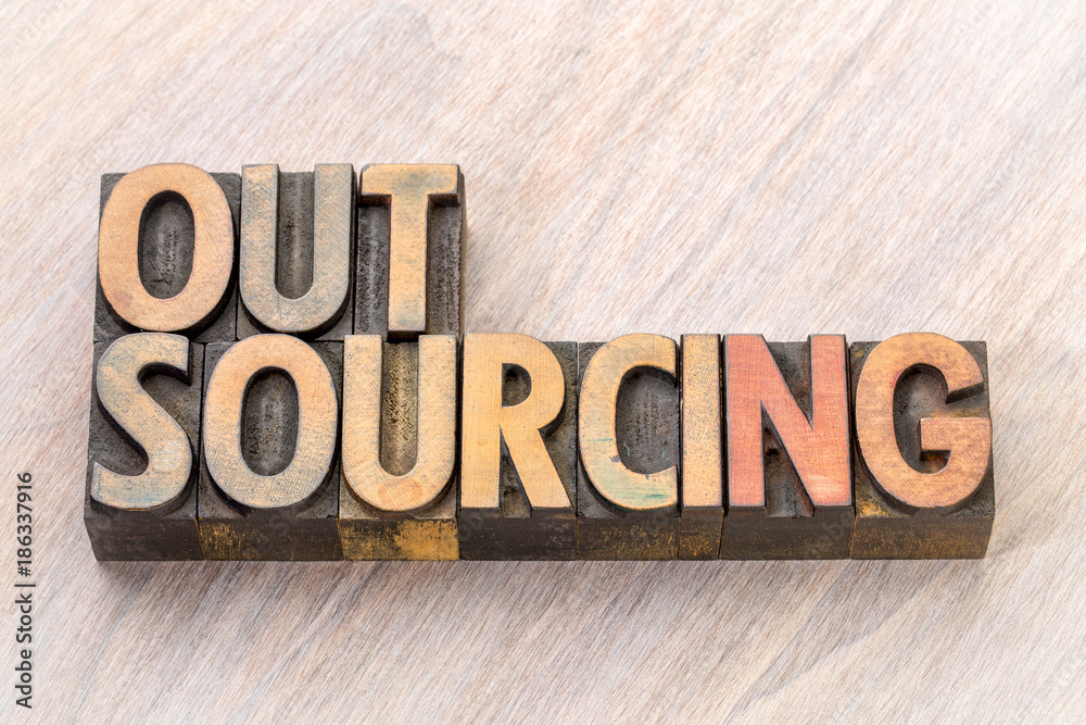 Fototapeta premium outsourcing word abstract in wood type