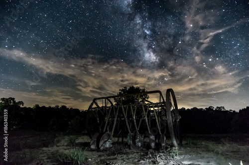 Milky way over old farm equipment © Paul