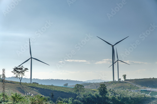 Wind Turbine on Hill, green energy. wind turbine wiht electric pole