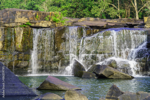 Waterfall on river in the deep jungle