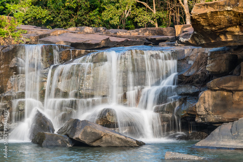 Waterfall on river in the deep jungle