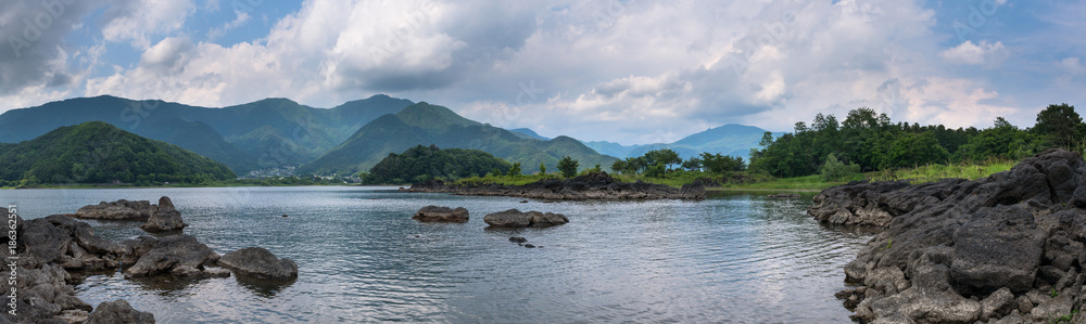 Rocky volcanic shores of the Kawaguchi lake, Japan Rocky volcanic shores of the Kawaguchi lake, Japan