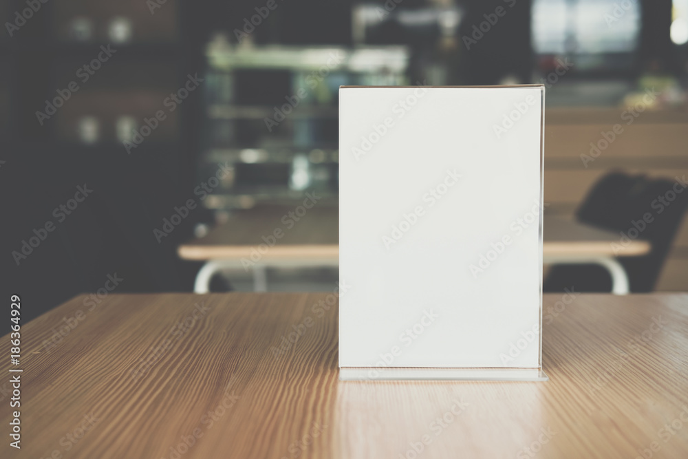 white label in cafe. display stand for acrylic tent card in coffee shop. mockup menu frame on table in bar restaurant. white label in cafe. display stand for acrylic tent card in coffee shop. mockup menu frame on table in bar restaurant.
