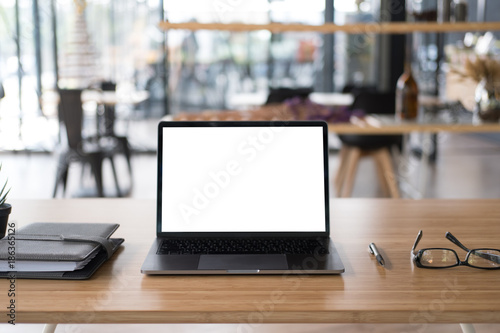 ballpoint pen, computer, eyeglasses, notebook on office desk. business, workplace, education concept.