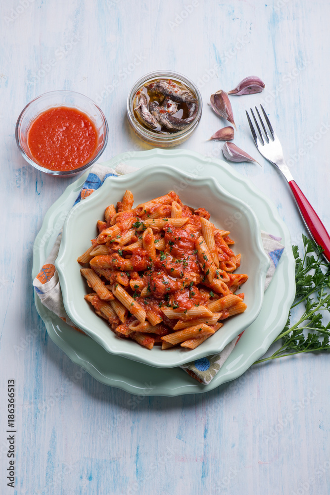 pasta with tuna  anchovyand tomatoes sauce