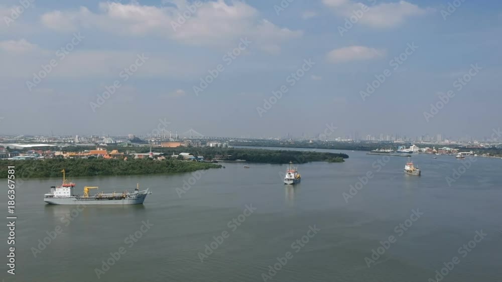 Aerial view panning left panoramic of Gulf of Thailand, Cargo ship, Phra Samut Chedi and Rama IX Bridge Samutprakarn, Thailand. Aerial view panning left panoramic of Gulf of Thailand, Cargo ship, Phra Samut Chedi and Rama IX Bridge Samutprakarn, Thailand.