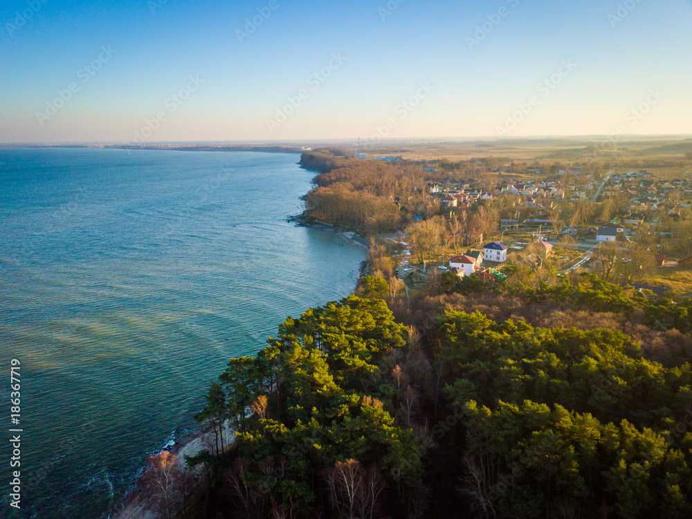 Aerial view of Baltic sea coast with small settlement